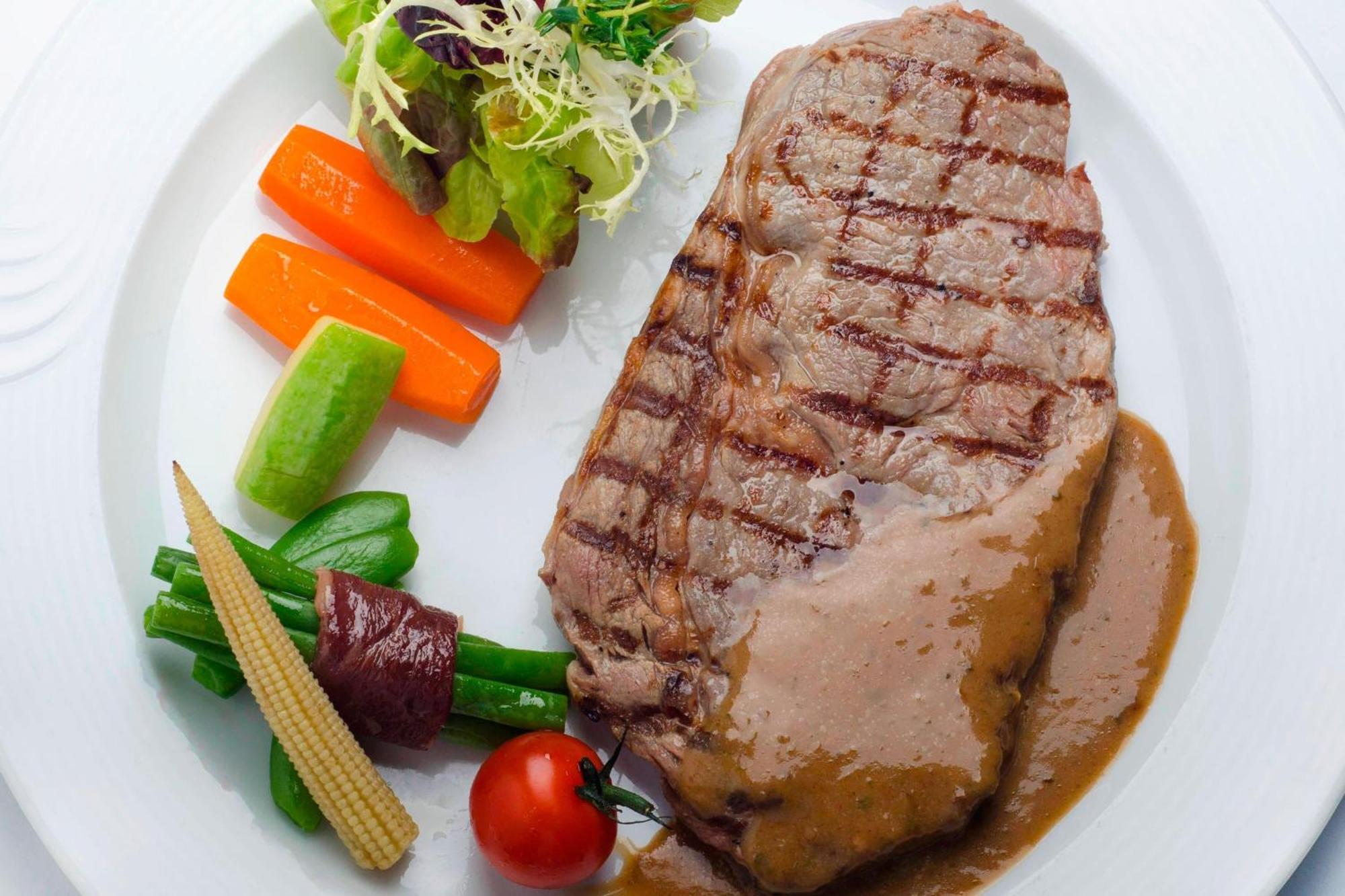 Le Meridien Al Khobar Exterior photo A steak with vegetables
